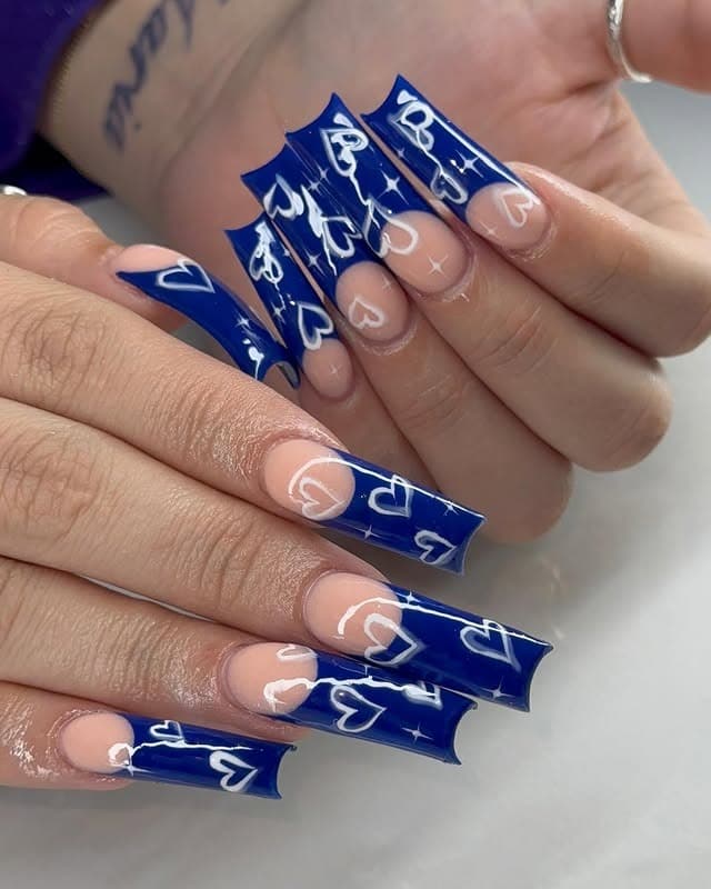 18. Royal Blue Curve Nails with White Heart Line Art - curved nail ideas