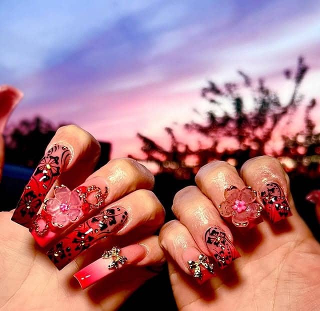 21. Cherry Blossom Curve Nails in Red and Pink - curved nail ideas