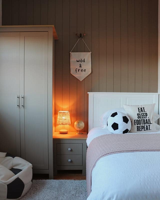4. Soft Amber Lighting and Pale Neutrals - football bedroom ideas