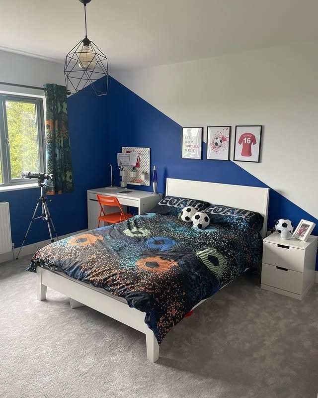 11. Bold Blue Geometric Wall with Sporty Accents - football bedroom ideas