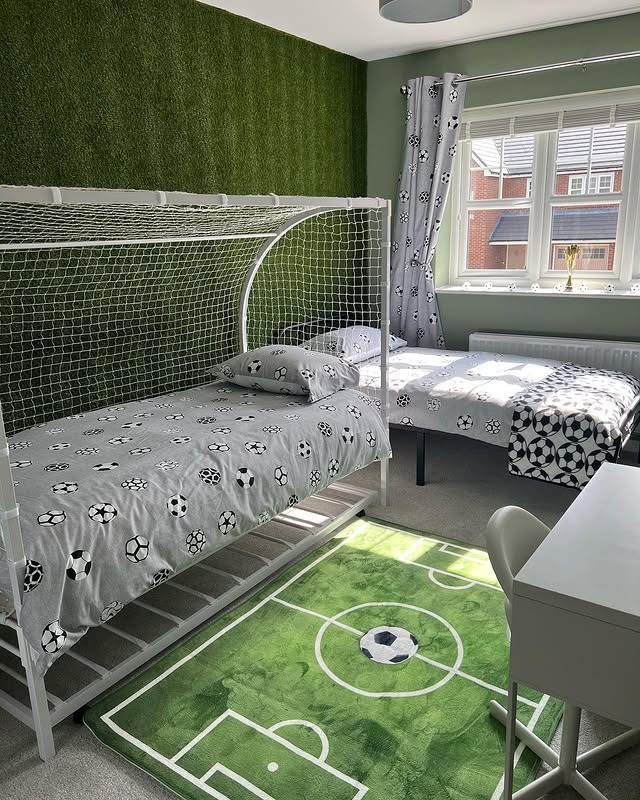21. Twin Football Beds with Turf Wall and Soft Green Palette - football bedroom ideas