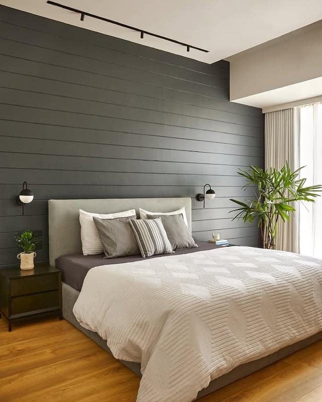 5. Contemporary Slate Wall with Textured Soft Bedding - grey wall bedroom ideas
