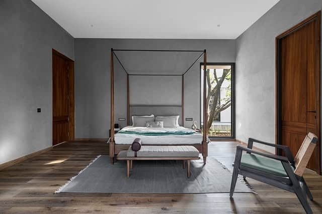 6. Modern Concrete Finish with Clean Architectural Lines - grey wall bedroom ideas