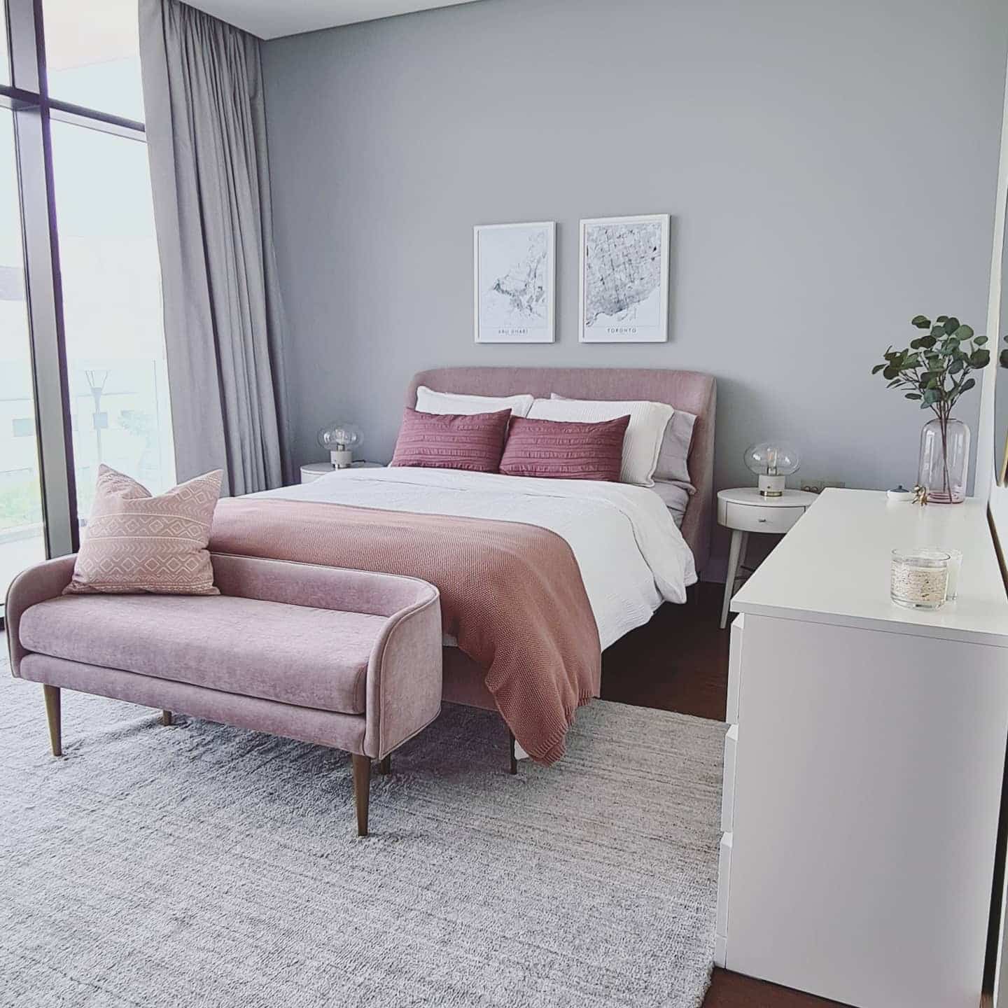 9. Blush-Accented Grey Retreat with Gentle Pastels - grey wall bedroom ideas