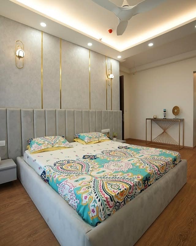 16. Soft Grey Vertical Panels with Gold Trim - grey wall bedroom ideas