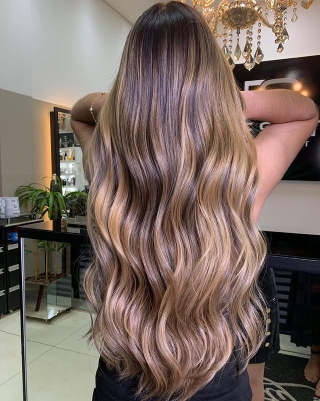 10. Light Brown Sunkissed Blend With Luxe Waves - Light Brown Hair Color