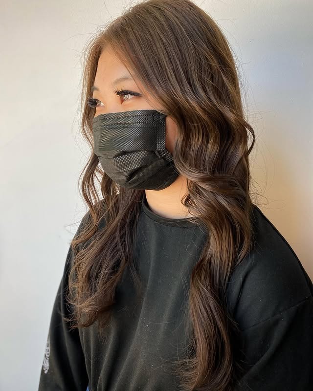 14. Chocolate-Light Brown Waves With Face Framing Lift - Light Brown Hair Color