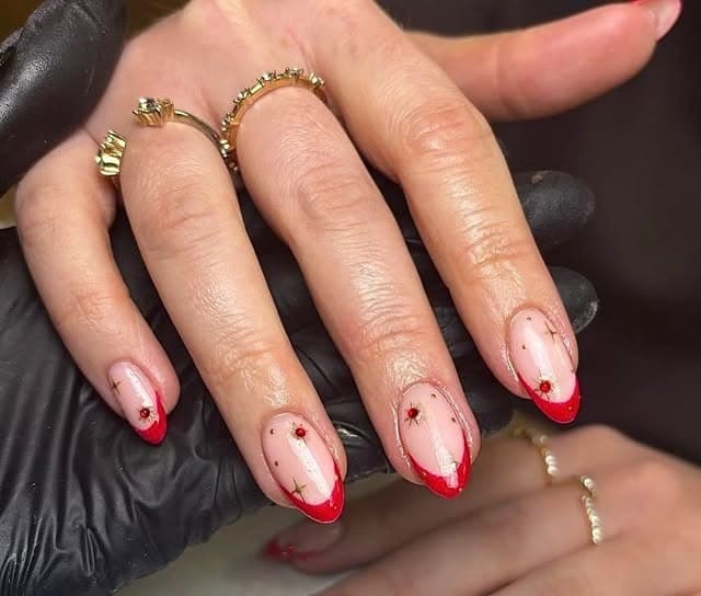 18. Red Almond French Tips with Gold Accents - cute french nail ideas