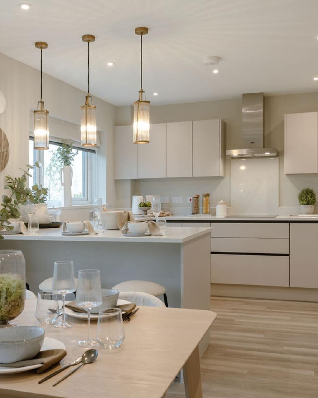 5. Neutral Luxe Kitchen with Brass Pendant Detail - open lounge kitchen ideas