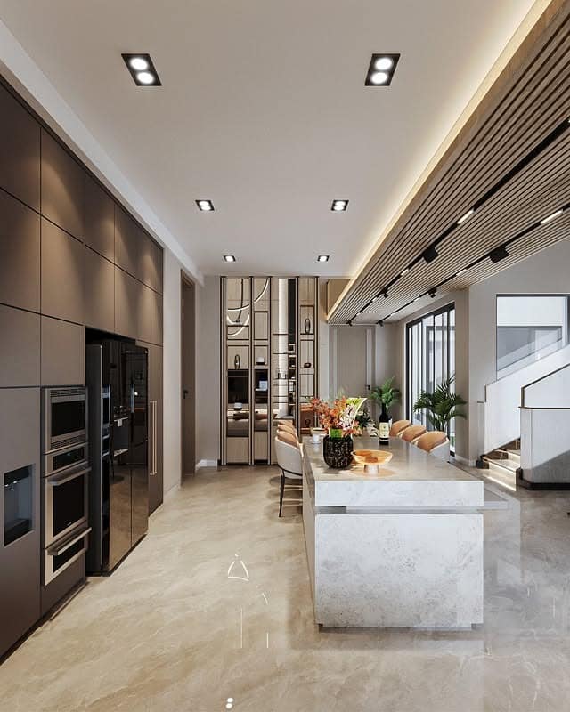 8. Stone Island Luxury Kitchen with Soft Metallic Highlights - open lounge kitchen ideas