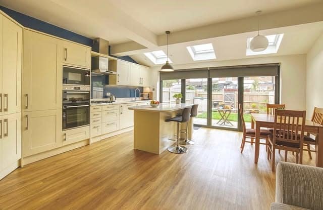 17. Cream and Navy Country-Modern Kitchen with Garden Connection - open lounge kitchen ideas