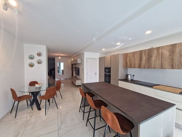 22. Contemporary Neutral Kitchen with Cognac Accents - open lounge kitchen ideas