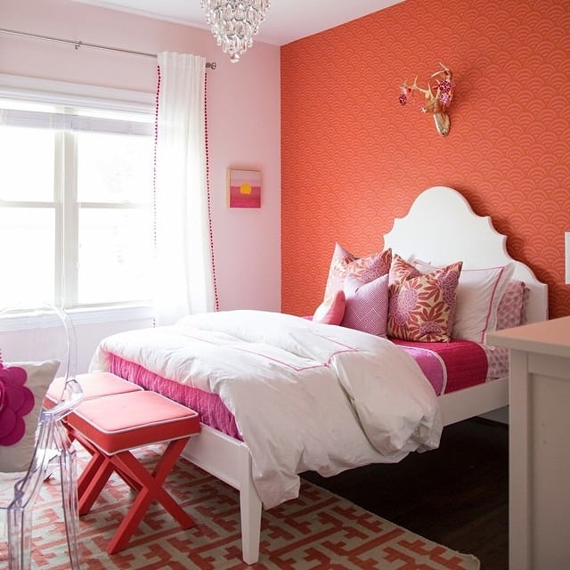 3. Playful Coral Feature Wall with Pink Accents - coral bedroom ideas