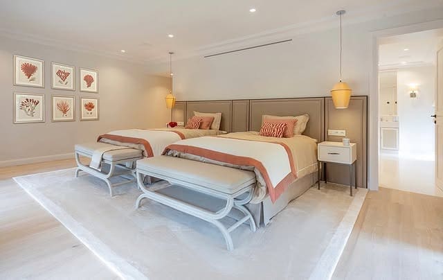 13. Refined Twin Suite with Coral Trim - coral bedroom ideas