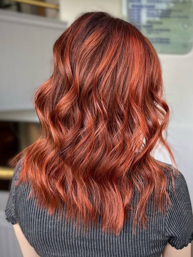 7. Vibrant Copper with Textured Waves - Copper Hair Color