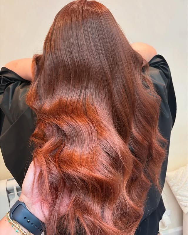 17. Copper-Toned Waves with Natural Lift - Copper Hair Color