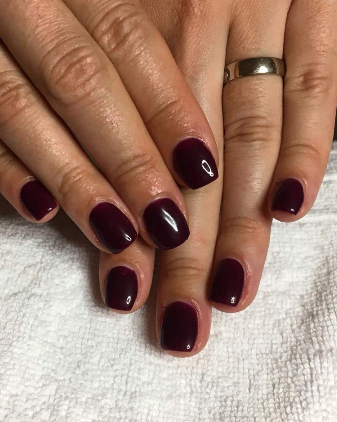 2. Plum Noir Short Classic Nails - dark color nail ideas