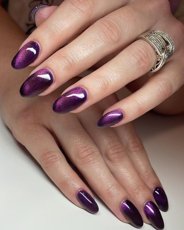 13. Violet Metallic Almond Nails - dark color nail ideas