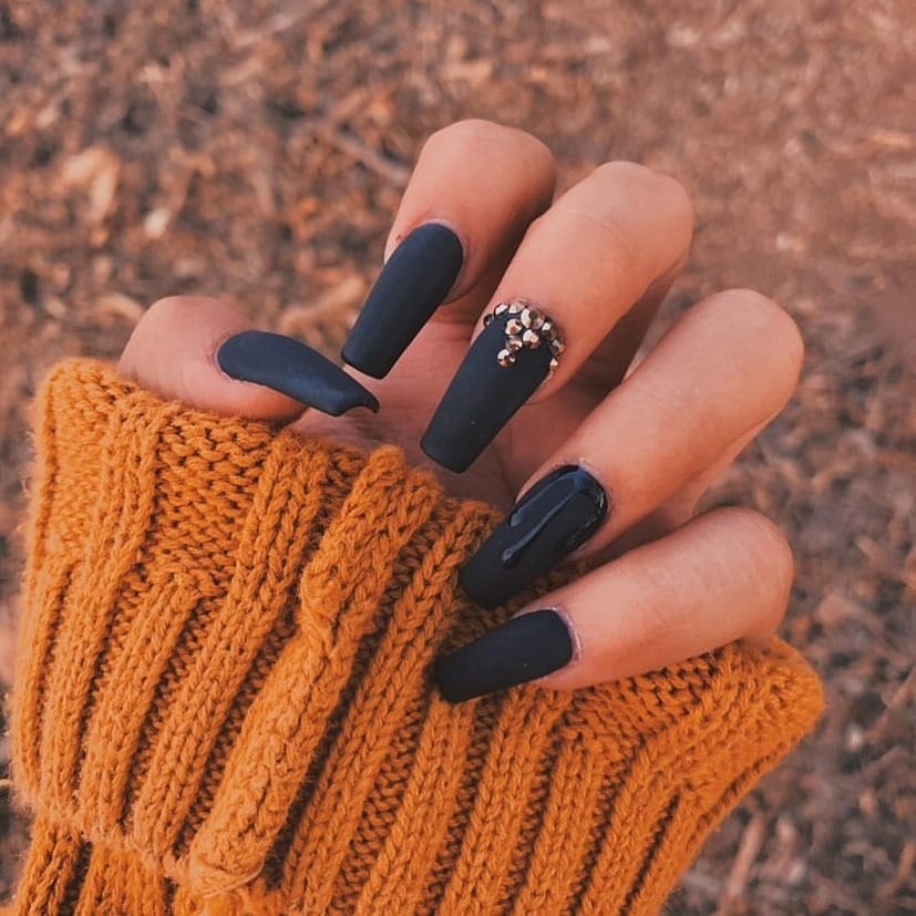 14. Matte Midnight Coffin Nails with Crystal Detail - dark color nail ideas