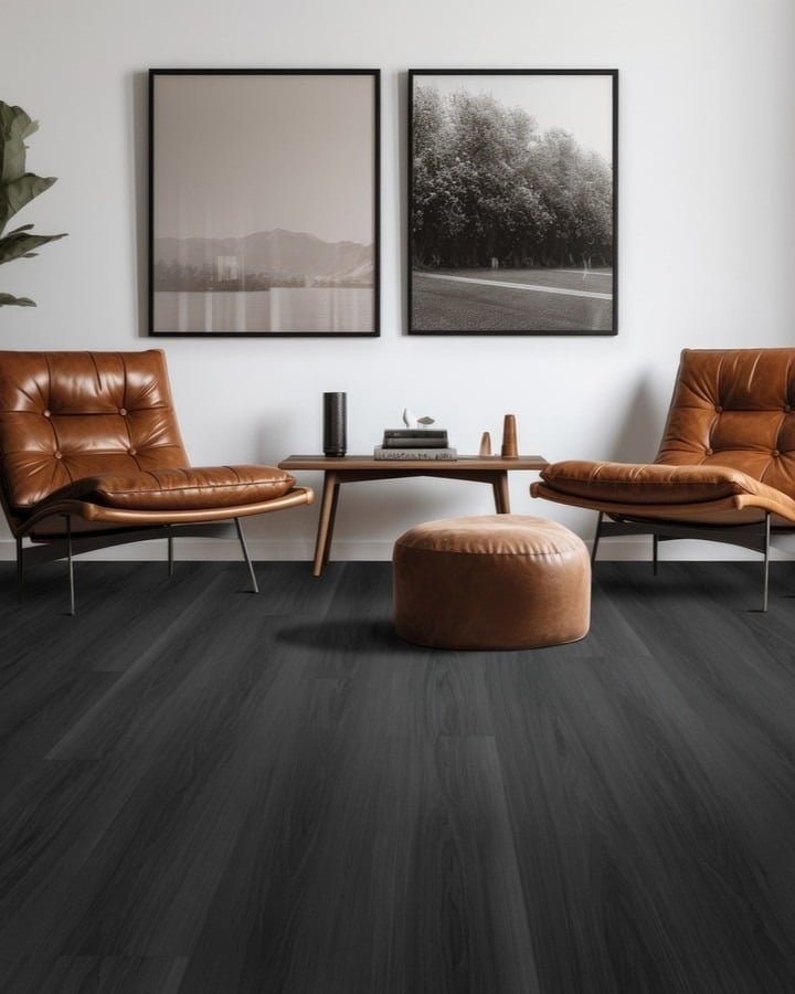 18. Moody Contrast with Charcoal Floors and Cognac Leather - dark wood floor living room ideas