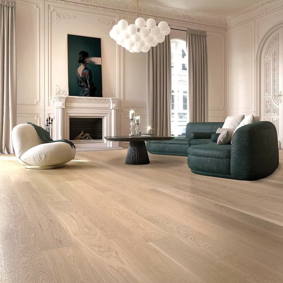 19. Parisian Soft Glam with Pale Wood and Emerald Upholstery - dark wood floor living room ideas