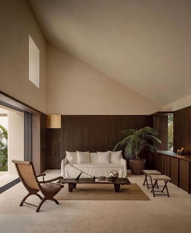 20. Warm Minimal Sanctuary with Dark Paneling and Gentle Neutrals - dark wood floor living room ideas