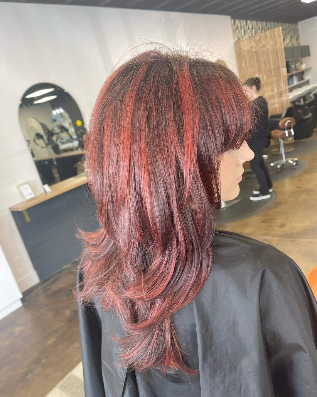 1. Layered Cherry-Red Shag with Soft Fringe - Red Hair with Highlights