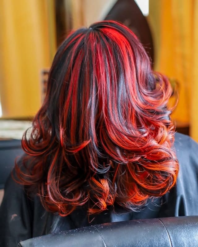 13. Fire Red Streaks on Voluminous Black Layers - Red Hair with Highlights
