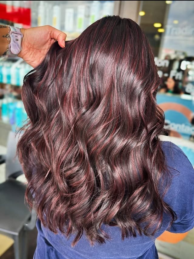 22. Soft Burgundy Waves with Rose-Tinted Detailing - Red Hair with Highlights