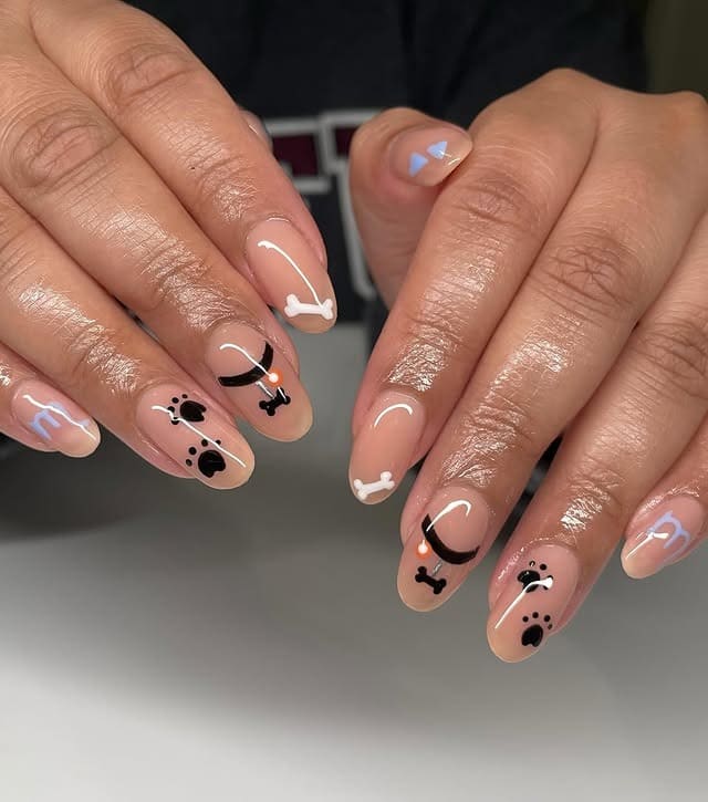 2. Neutral Pup Prints & Bone Details - dog nail ideas