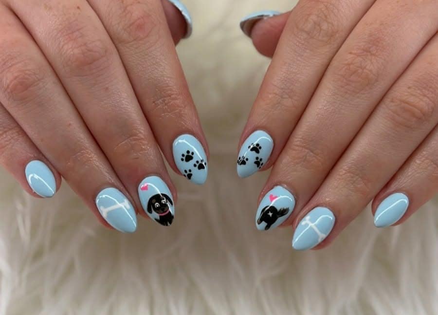 13. Sky Blue Paw Trails with Puppy Faces - dog nail ideas