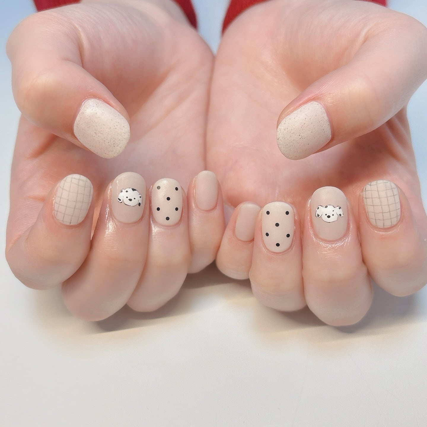 15. Creamy Neutrals with Dotted Pups & Grids - dog nail ideas