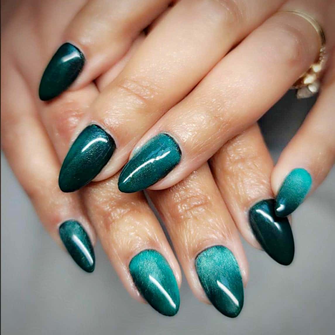 11. Soft Cat-Eye Emerald Gradient Almond Nails - emerald nail ideas