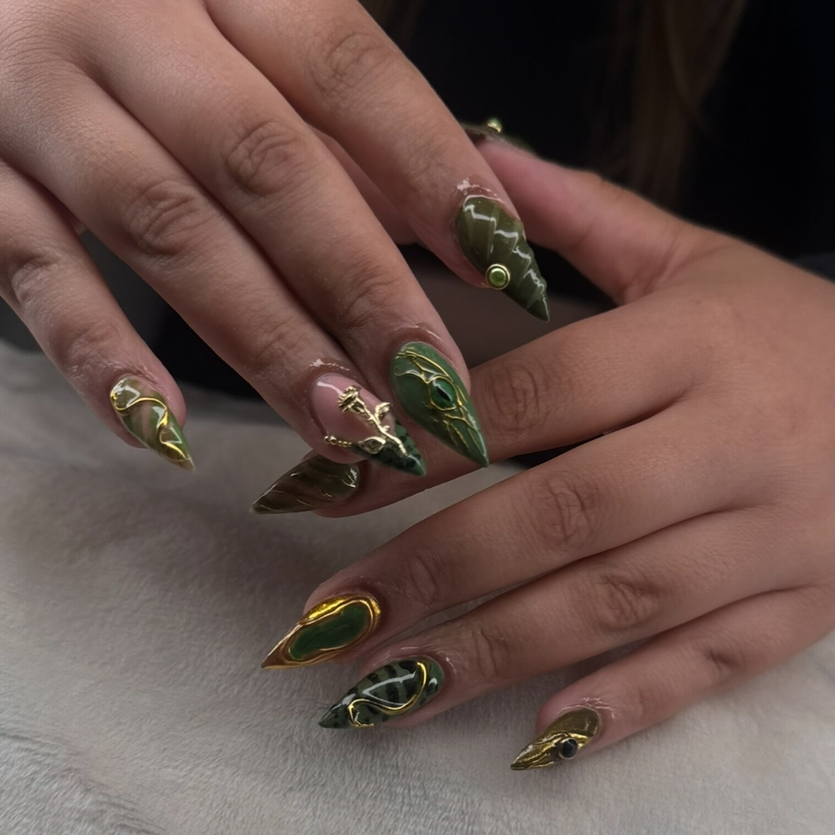 18. Deep Olive and Emerald Marble Nails With Gold Frames - emerald nail ideas