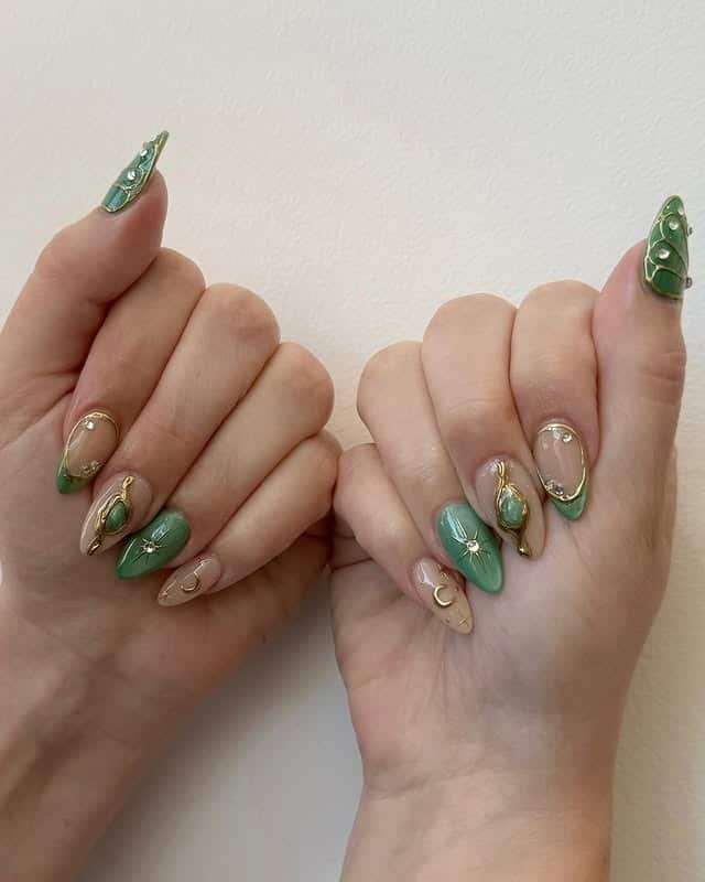 19. Emerald Gemstone Art Nails With Gold Outline Details - emerald nail ideas