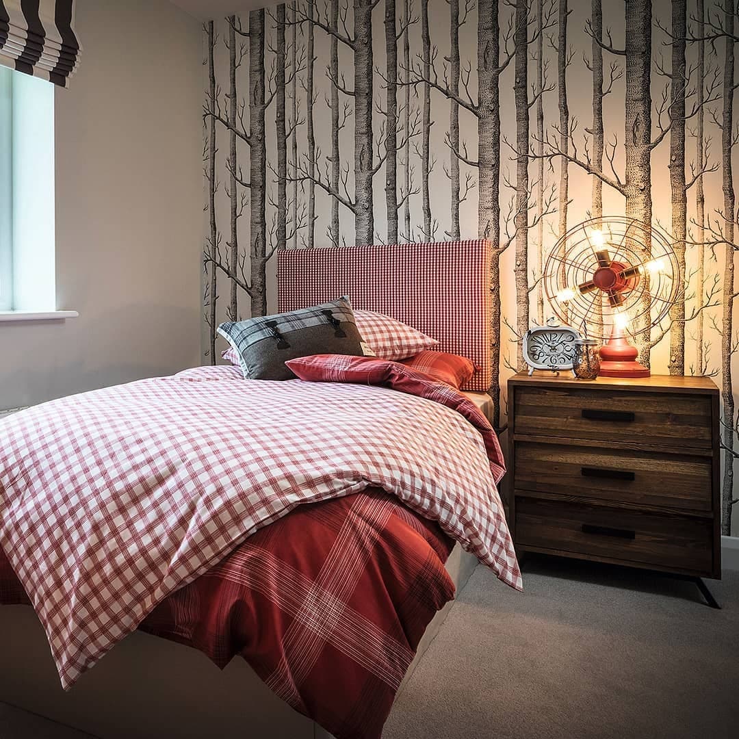 5. Cozy Cabin Corner in Reds and Earthy Browns - cool bedroom ideas