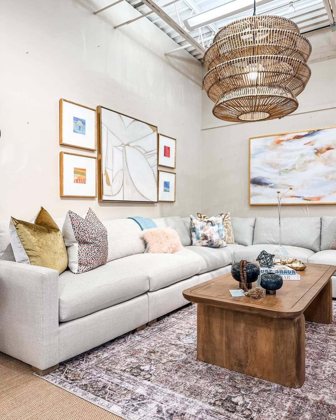 1. Soft Neutrals with Artistic Layers - sectional living room ideas