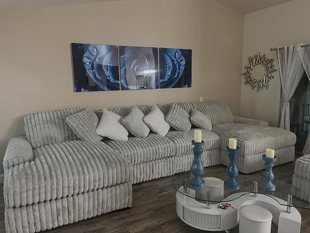 13. Soft Silver Channel-Tufted Sectional with Cool Tones - sectional living room ideas