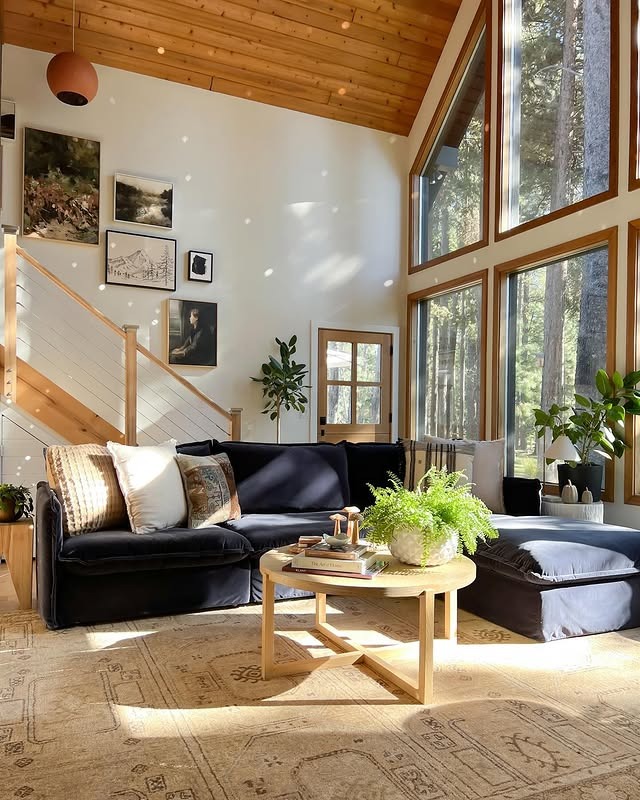 18. Charcoal Sectional in a Sun-Filled Cabin Setting - sectional living room ideas