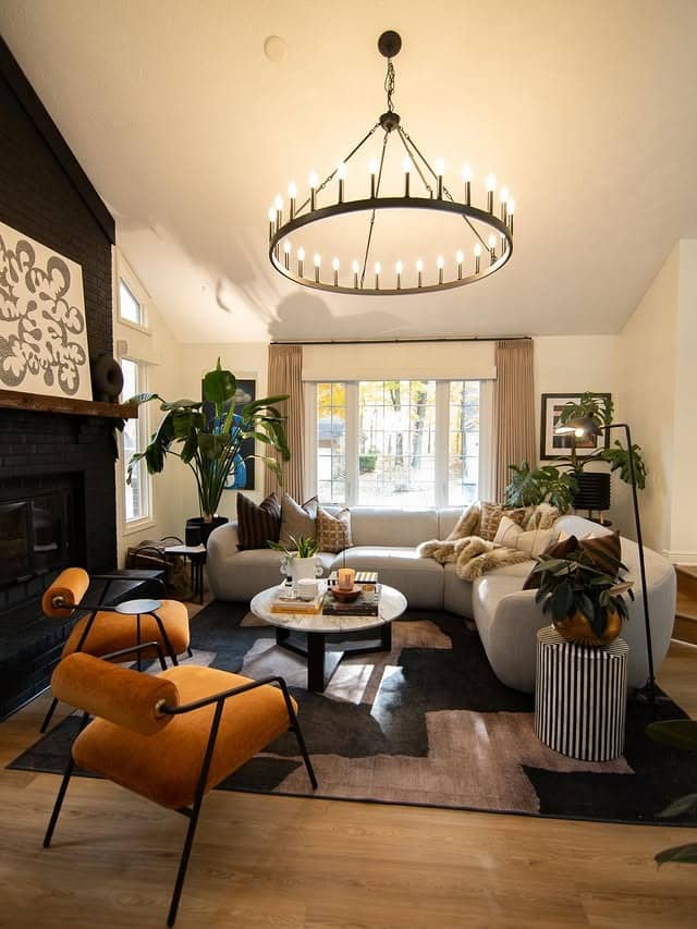 19. Curved Neutral Sectional with Warm Amber Accents - sectional living room ideas