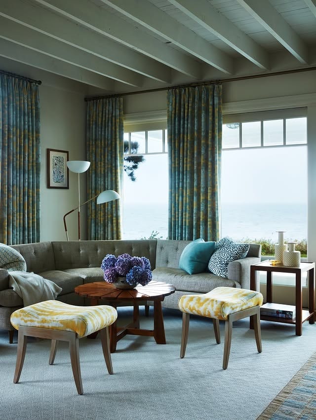 22. Coastal-Inspired Taupe Sectional with Blue and Gold Notes - sectional living room ideas