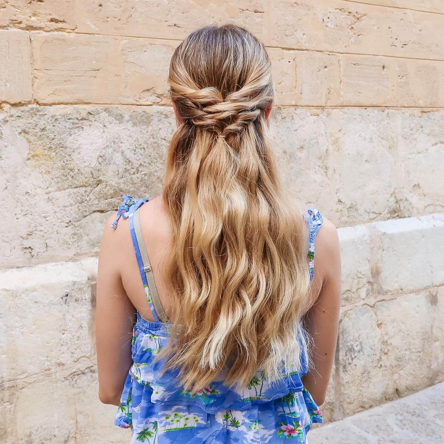 6. Twisted Half-Up Style on Golden Waves - Summer Hairstyles