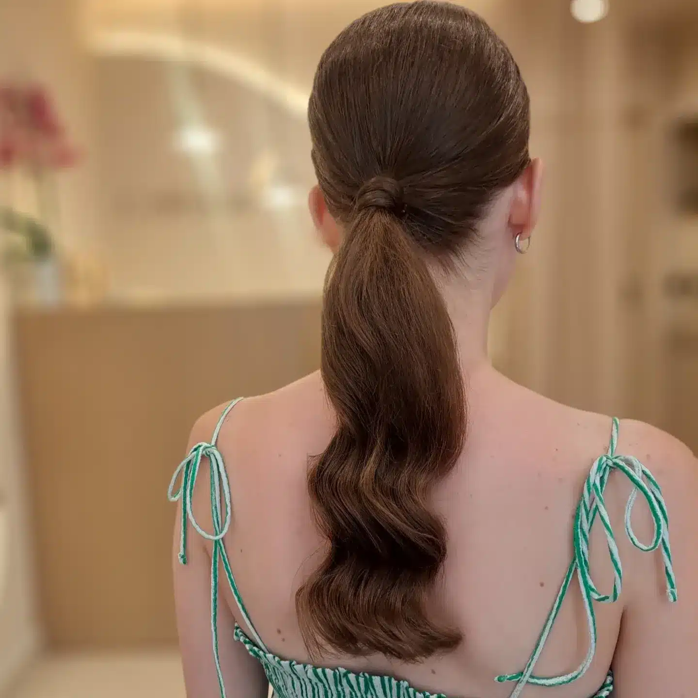 18. Sleek Low Ponytail with Ribboned Detail - Summer Hairstyles