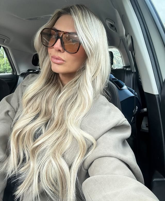 22. Icy Champagne Blonde Waves with Feathered Layers - Summer Hairstyles