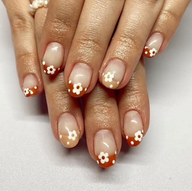 3. Terracotta Daisy Tip Nails - fall flower nail ideas