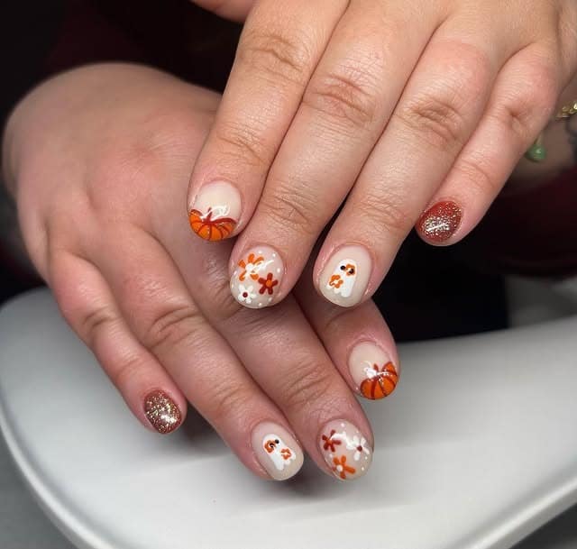 7. Pumpkin Patch Floral Short Nails - fall flower nail ideas