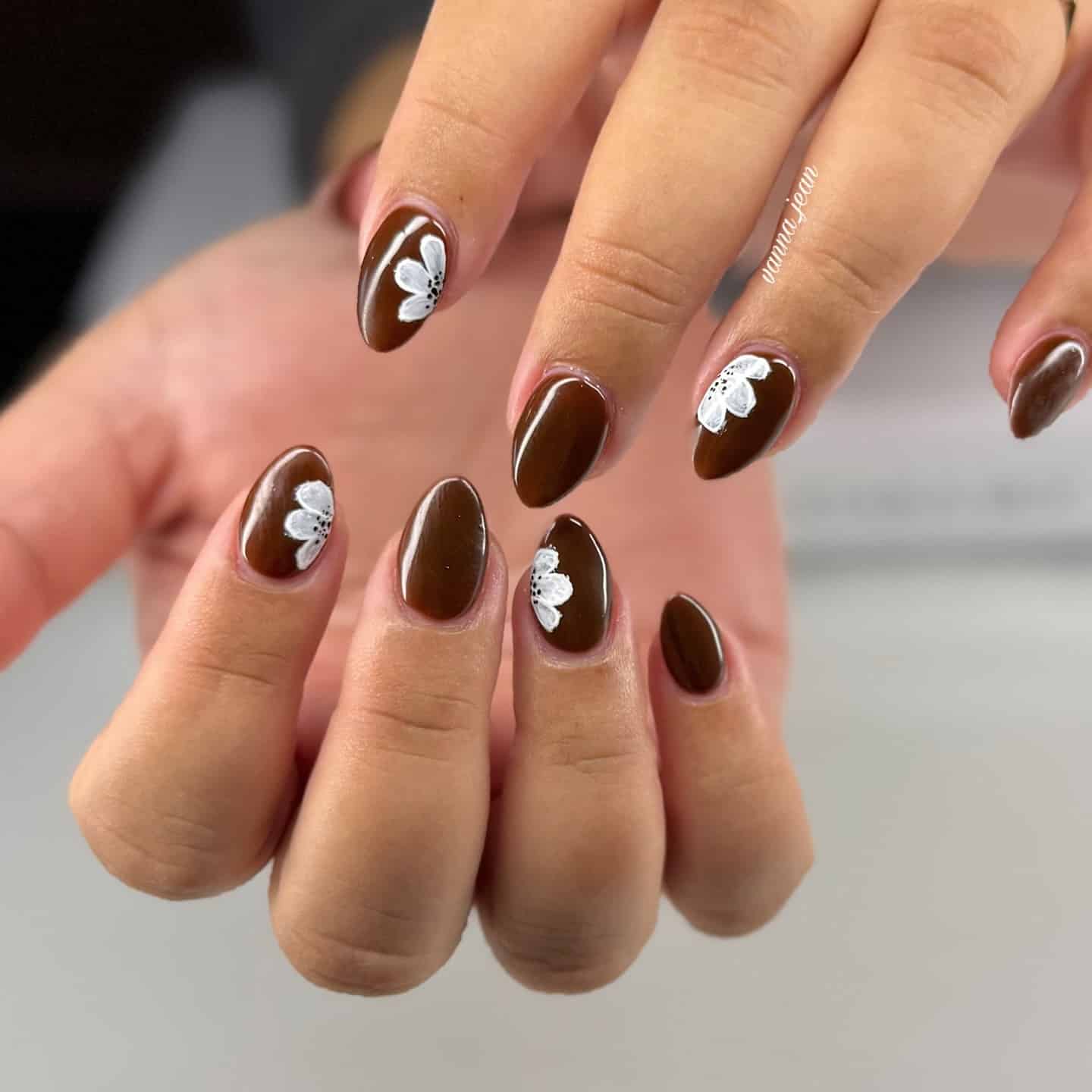 17. Chocolate Brown Floral Accent Almond Nails - fall flower nail ideas