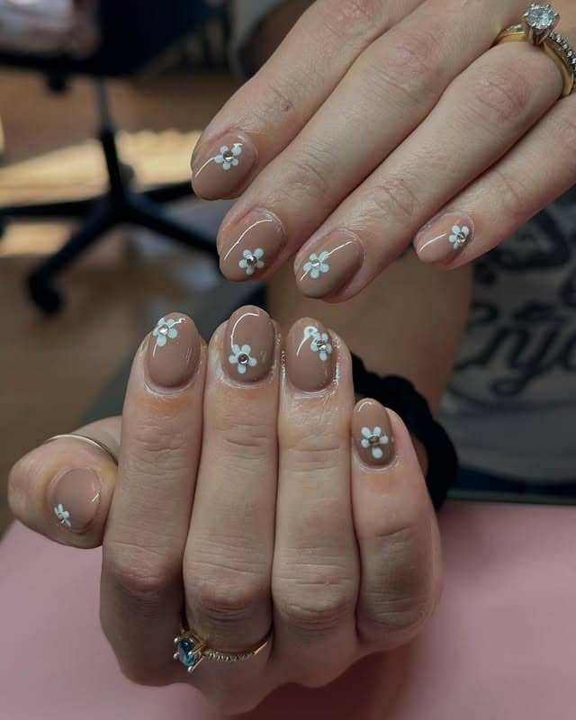 21. Soft Latte Blossoms on Short Round Nails - fall flower nail ideas