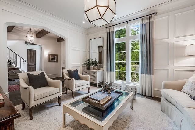 4. Traditional Elegance in Soft Whites & Muted Blues - elegant living room ideas