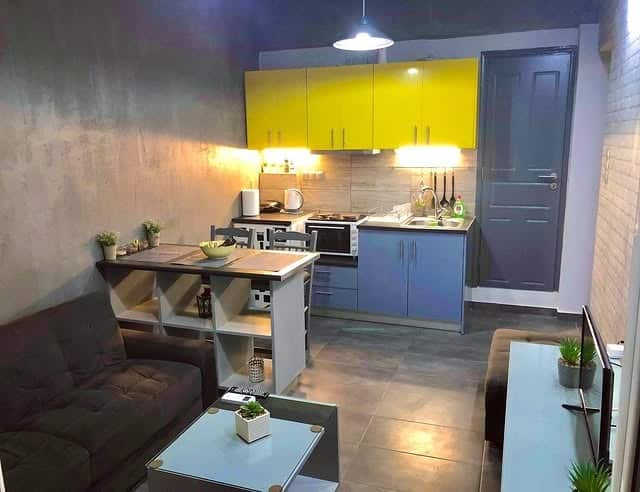 1. Compact Urban Kitchen with Yellow Accents - yellow and grey kitchen ideas